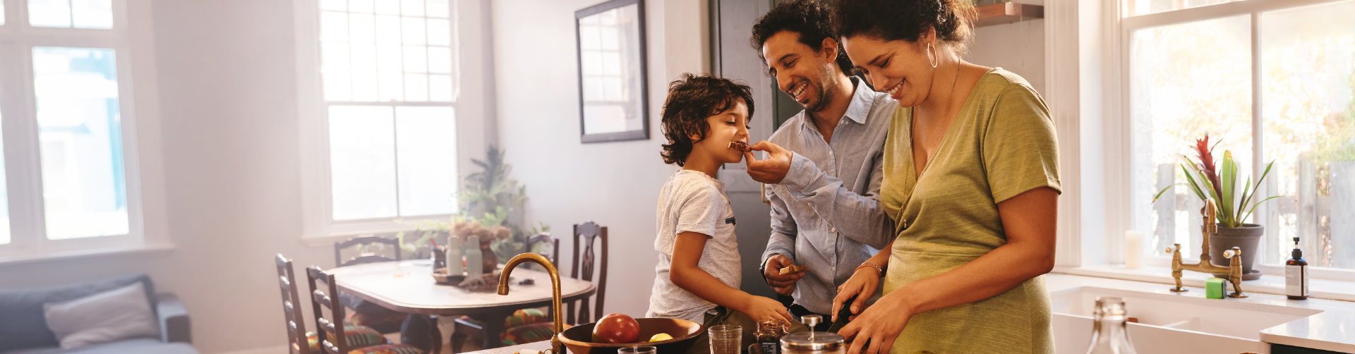 family in kitchen with hybrid heat comfort